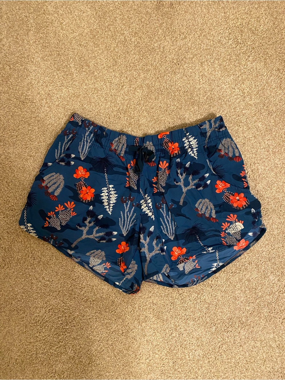 The North Face Navy Floral Athletic Shorts with Coral Accents